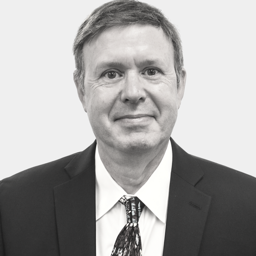 Portrait of a middle-aged man in a suit and tie.