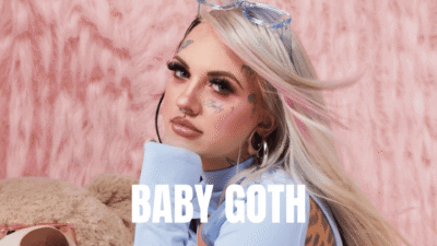 A young woman with platinum blonde hair and a bold makeup.