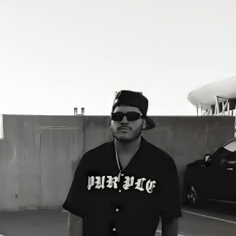 Man in sunglasses and backward cap